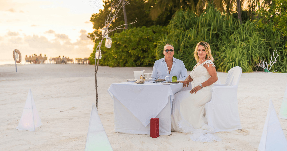 Romantic candlelit dinner for a couple on a Zanzibar beach honeymoon