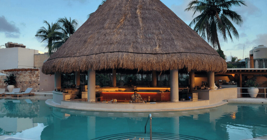 Couple planning their Zanzibar honeymoon while walking on a white sand beach