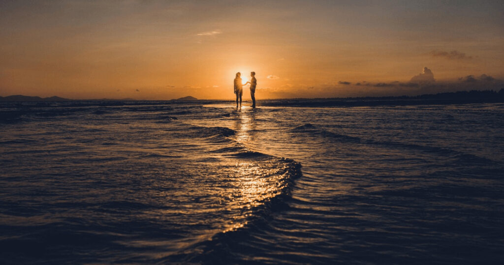 Couple enjoying a sunset dhow cruise in Zanzibar during their honeymoon