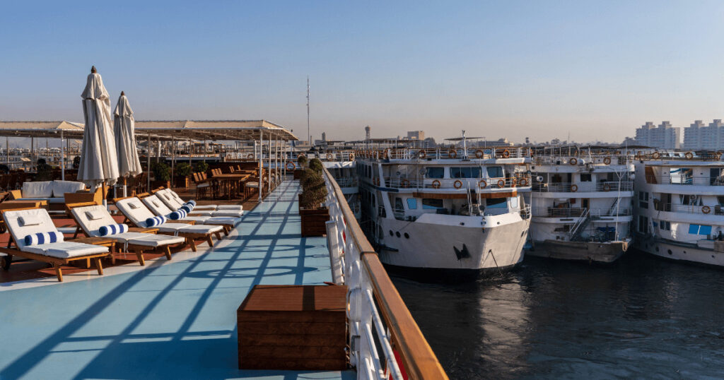 Romantic hotels Egypt – Nile cruise at sunset with couples enjoying the river view.
